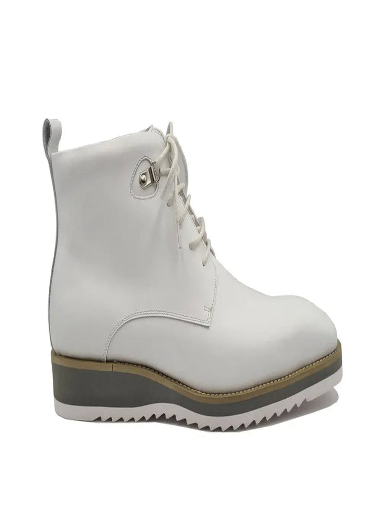 White leather boots with black sole