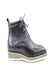 Matte black boots with white sole