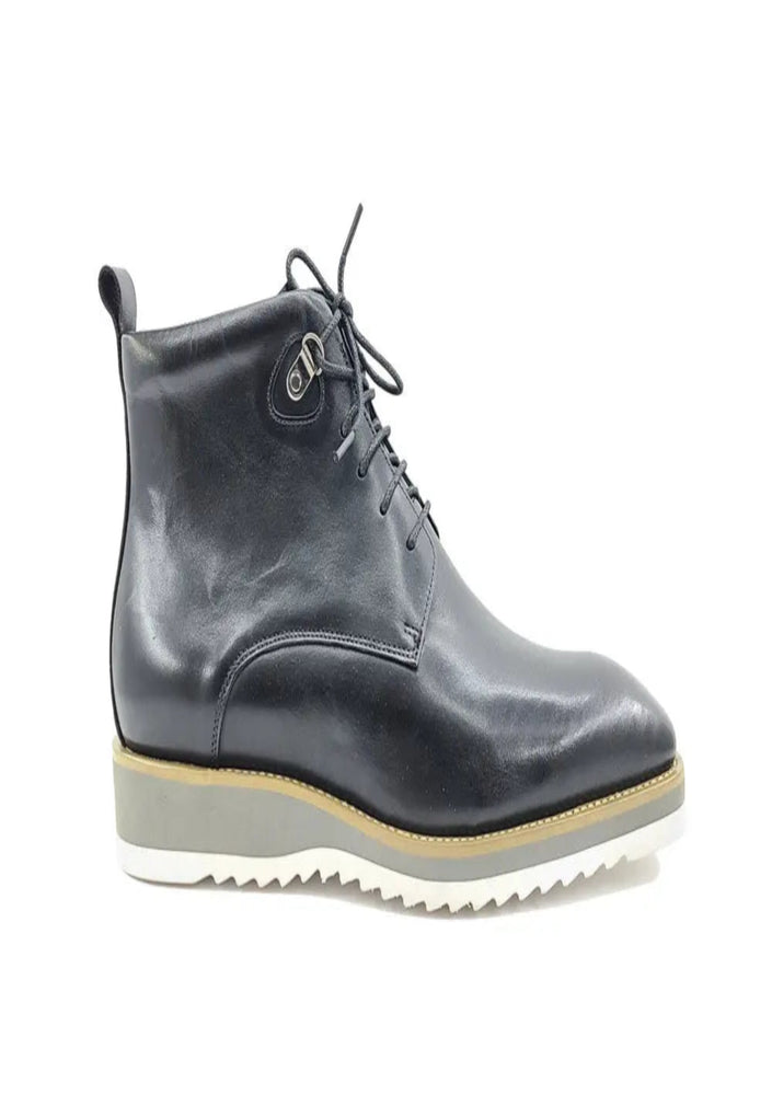 Matte black boots with white sole