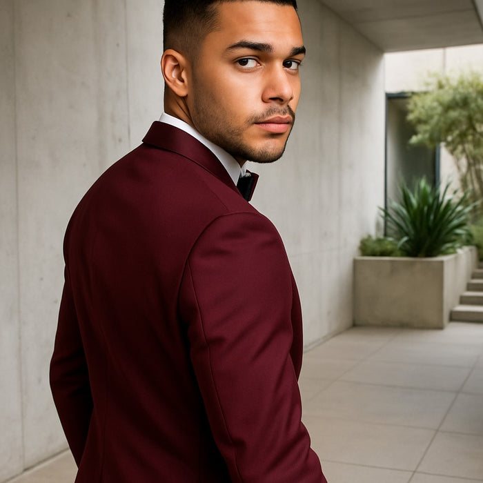 burgundy-tuxedo-leaning-on-wall